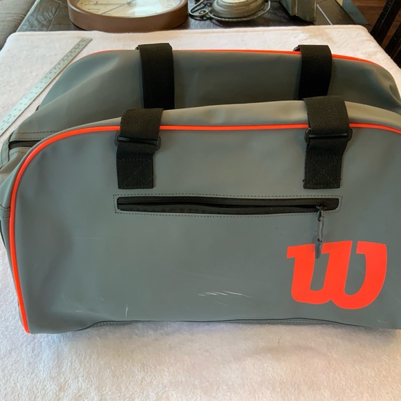 Wilson Gray and Orange Duffel Bag with Sporty Design. SKU 2477 - Picture 1 of 9